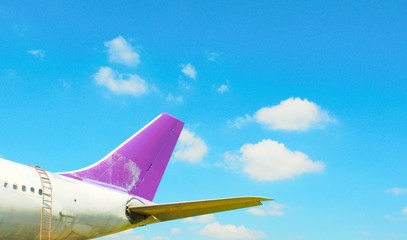 airplane flying in the sky with clouds