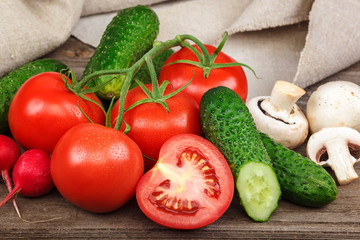 Fresh vegetables on a cutting board with a knife