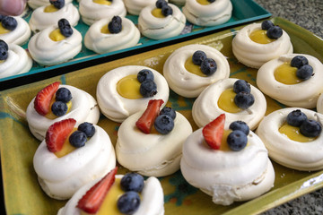 Gourmet homemade traditional Pavlova meringue sweet desset party cake with whipped cream, strawberry