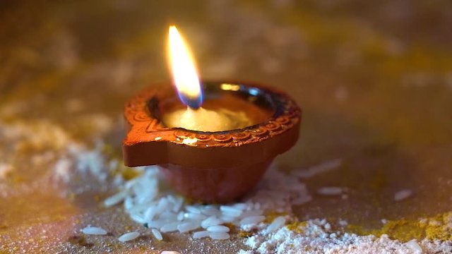 Diya Deepak Candle on Rice, Indian Hinu Wedding Celebration Ritual, Close Up