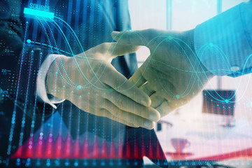 Multi exposure of financial graph on office background with two businessmen handshake. Concept of success in business