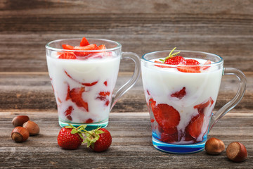 Fresh strawberries with sour cream in a bowl