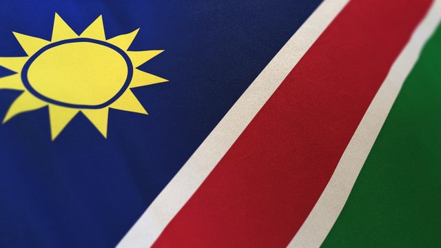3D rendering of the national flag of Namibia waving in the wind. The banner/emblem is made of realistic satin texture and rendered in a daylight situation. 