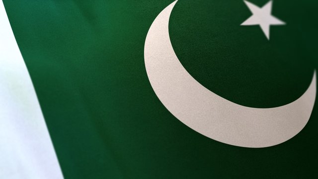 3D rendering of the national flag of Pakistan waving in the wind. The banner/emblem is made of realistic satin texture and rendered in a daylight situation. 