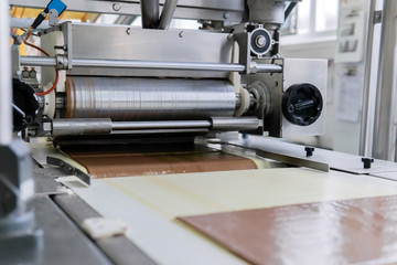 chocolate wafer pouring at a confectionery factory