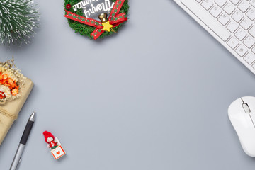 Merry Christmas and Happy new years office work space desktop concept. Flat lay top view with keyboard and Christmas ornaments with copy space.