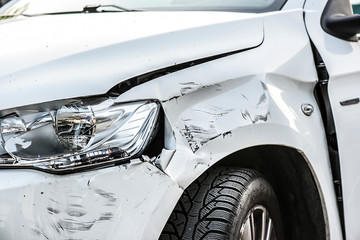 Car crash or accident. Front fender and light damage and scratchs on bumper. Broken vehicle detail...