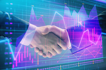 Multi exposure of forex graph on abstract background with two businessmen handshake. Concept of success on stock market