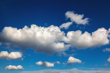 Fototapeta premium Blue sky with white clouds as a backdrop