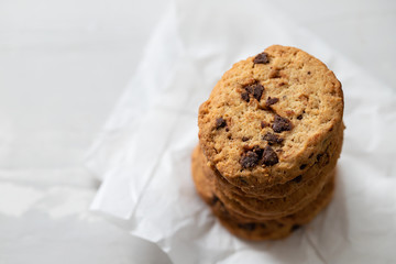 cookies with chocolate chips on ceramic background