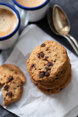coffee and cookies with chocolate chips on ceramic background