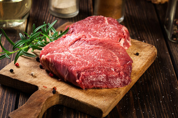 Fresh raw beef steak sirloin with rosemary - 297343686
