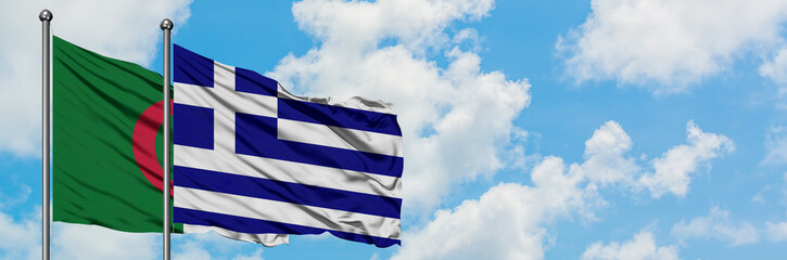 Algeria and Greece flag waving in the wind against white cloudy blue sky together. Diplomacy concept, international relations.