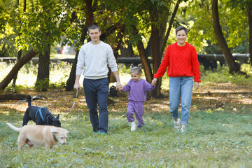 Obraz premium Young family with Dogs.