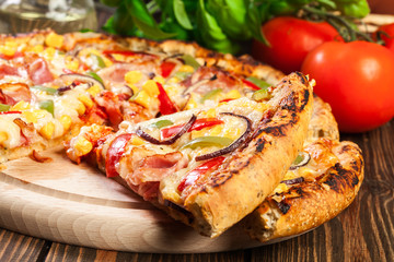 Homemade pizza with bacon, paprika and corn