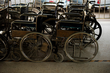 Fototapeta na wymiar Row Wheelchairs in the hospital ,Wheelchairs waiting for patient services.