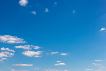 Blue sky with white clouds as a background