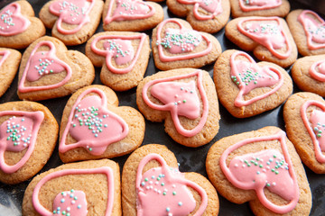 Hands hold gingerbread cookies in form of heart