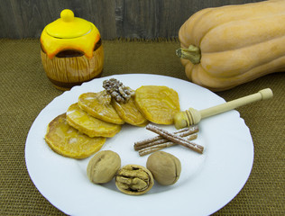 Pumpkin pancakes with honey sauce, cinnamon and walnuts