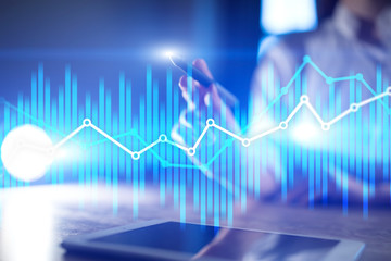 Double exposure economic charts and graphs on virtual screen. Online trading, Business and finance concept.