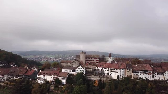 Circle aerial around swiss oldtown with beautiful castle and monuments