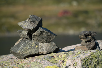 Stone pyramid in Norway with landscape background 