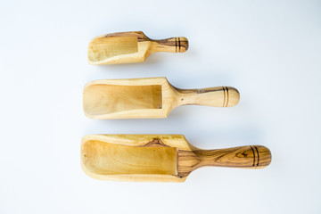 Traditional wood object wooden scoop or spoon isolated on a white background from various angle and top view