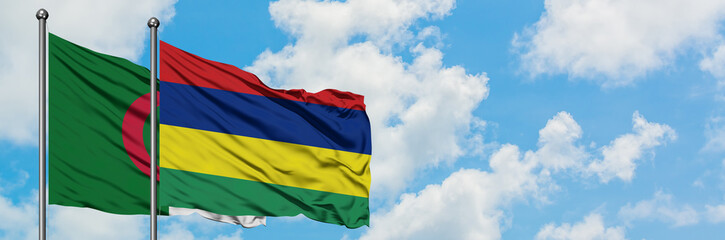 Algeria and Mauritius flag waving in the wind against white cloudy blue sky together. Diplomacy concept, international relations.