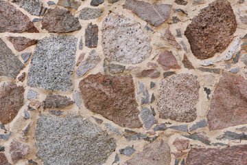 Old historical granite stone wall.