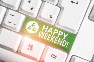 Writing note showing Happy Weekend. Business concept for something nice has happened or they feel satisfied with life White pc keyboard with note paper above the white background
