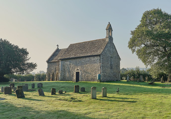 Buncton Church and churchyard on a sunny summer morning