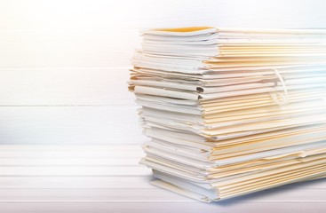 File folders with documents isolated on white background