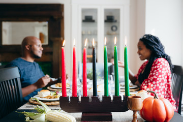 Husband and wife talking during Kwanzaa