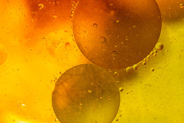 Abstract colorful background. Foam of Soap with Bubbles macro shot. Closeup bubbles in water. Oil...