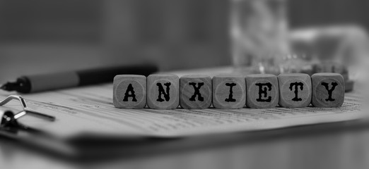 Word ANXIETY composed of wooden dices. - obrazy, fototapety, plakaty