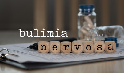 Word BULIMIA NERVOSA composed of wooden dices.