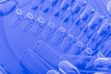 Glass medical ampoule vial for injection. Medicine is liquid sodium chloride with of aqueous...