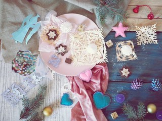  Sweet dessert on a plate, festive decor, hearts, fir branches on a wooden table, top view, Valentines day, Christmas, seasonal winter holidays