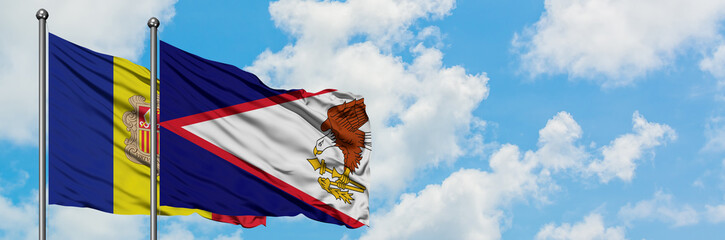 Andorra and American Samoa flag waving in the wind against white cloudy blue sky together. Diplomacy concept, international relations.