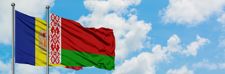 Andorra and Belarus flag waving in the wind against white cloudy blue sky together. Diplomacy concept, international relations.