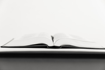 An open book on a table.