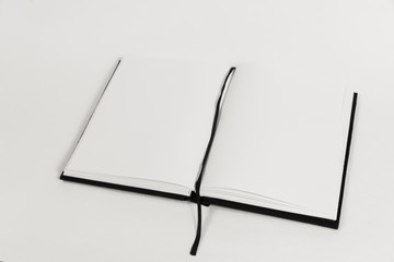 An open book on a table.