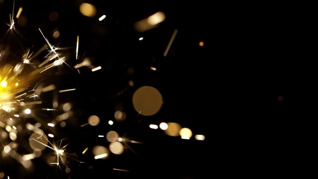 Super slow motion of burning sparklers on black background. Filmed on high speed cinema camera, 1000fps.