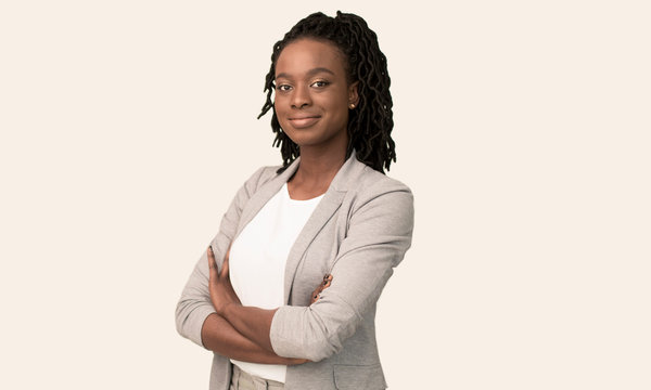Afro Businesswoman Smiling At Camera Crossing Hands Posing, White Background