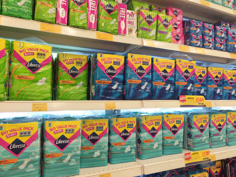 KUALA LUMPUR, MALAYSIA -SEPTEMBER 23, 2019: Selective focused of the woman sanitary napkin or sanitary pad displayed for sale on the rack inside the supermarket. Also known as sanitary towel.