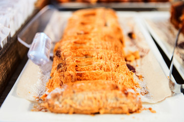 Sweet apple strudel pastry with nuts in cafe