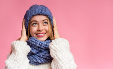 Super happy girl in blue knitted set looking up