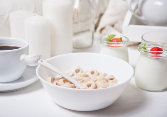 Delicious and nutritious cereal loops in a bowl with milk for healthy breakfast for kids