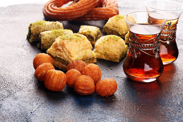 Baklava on table. Middle eastern or arabic dishes. Turkish Dessert Baklava with pistachio on rustic table