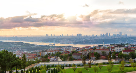 Obraz premium View on the Bosphorus Bridge and Istanbul skyscrappers from Camlica Hill, Turkey